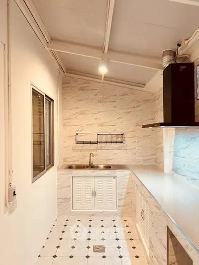 Modern kitchen with sleek marble design and ample counter space