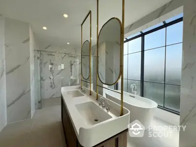 Luxurious modern bathroom with double sinks and freestanding bathtub