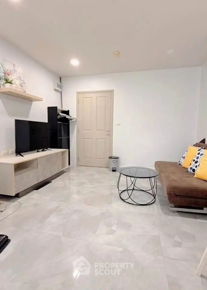 Modern living room with sleek furniture and neutral tones, perfect for cozy relaxation.