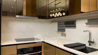 Modern kitchen with sleek cabinetry and built-in appliances