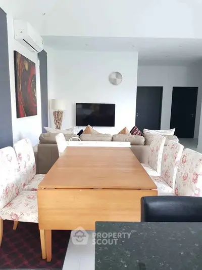 Spacious living room with elegant dining area and modern decor