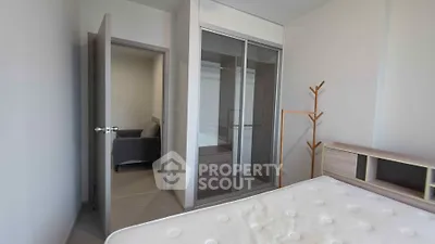 Modern bedroom with sleek wardrobe and minimalist decor