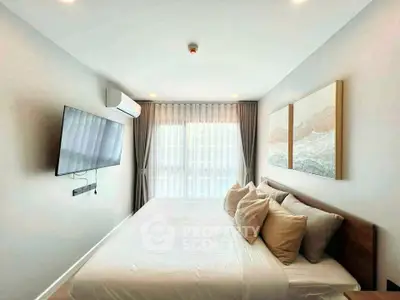 Modern bedroom with wall-mounted TV and large window with curtains