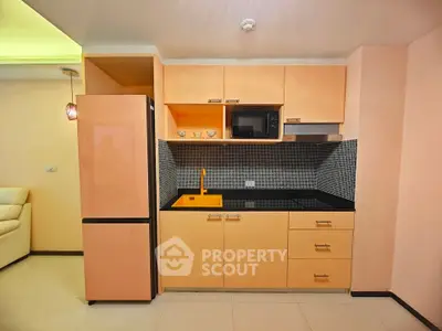 Modern kitchen with sleek cabinetry and built-in appliances in a stylish apartment.