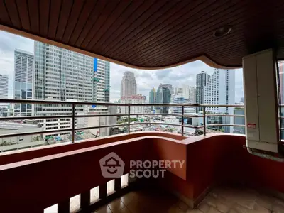 Stunning cityscape view from a spacious balcony in a high-rise building, perfect for urban living.