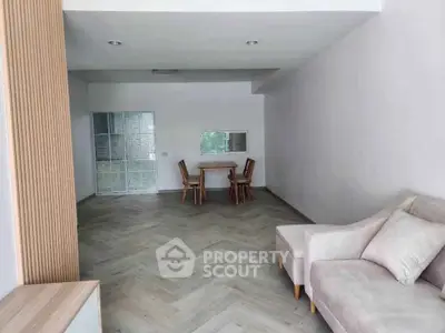 Spacious living room with modern furniture and elegant flooring