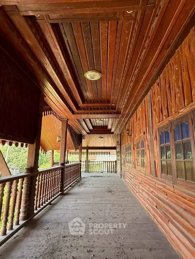 Charming wooden balcony with rustic design and scenic views, perfect for relaxation and enjoying nature.