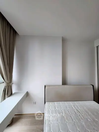 Minimalist bedroom with natural light and modern design