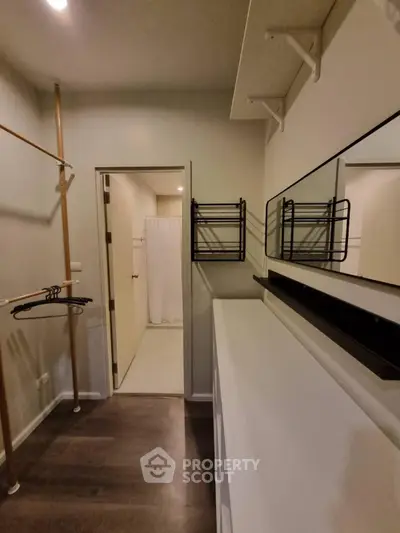 Spacious walk-in closet with ample shelving and hanging space