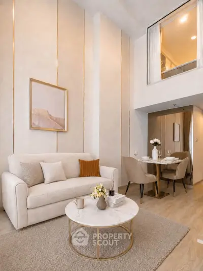 Elegant modern living room with high ceiling and cozy dining area, perfect for stylish urban living.