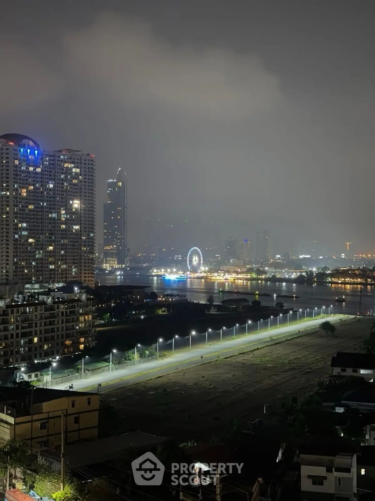 Stunning cityscape view with illuminated skyline and river at night