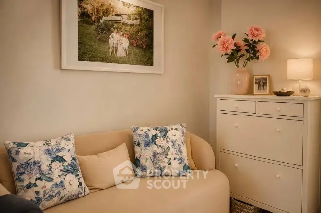 Cozy living room with elegant decor and floral accents, perfect for relaxation.
