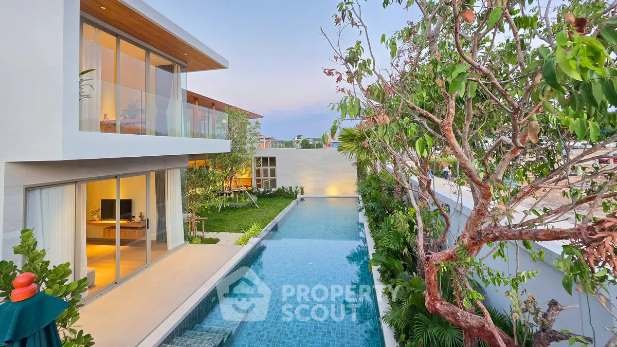 Luxurious modern villa with private pool and lush garden, perfect for serene living.