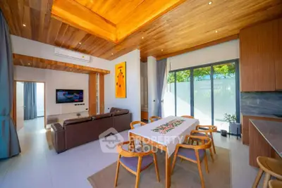 Stunning modern living room with wooden ceiling and open layout