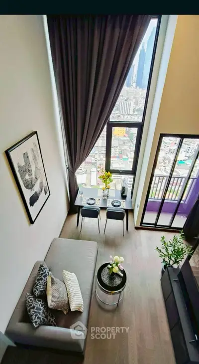 Stunning high-rise living room with floor-to-ceiling windows and city view, perfect for urban lifestyle.