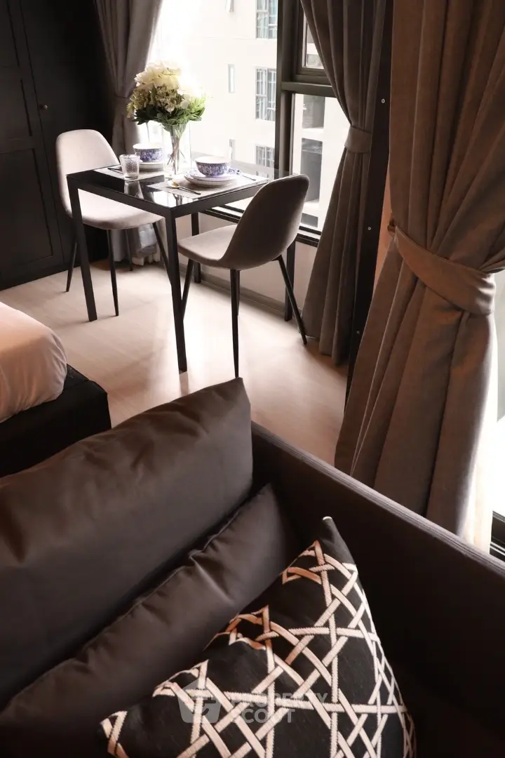 Modern apartment interior with stylish dining area and cozy seating.