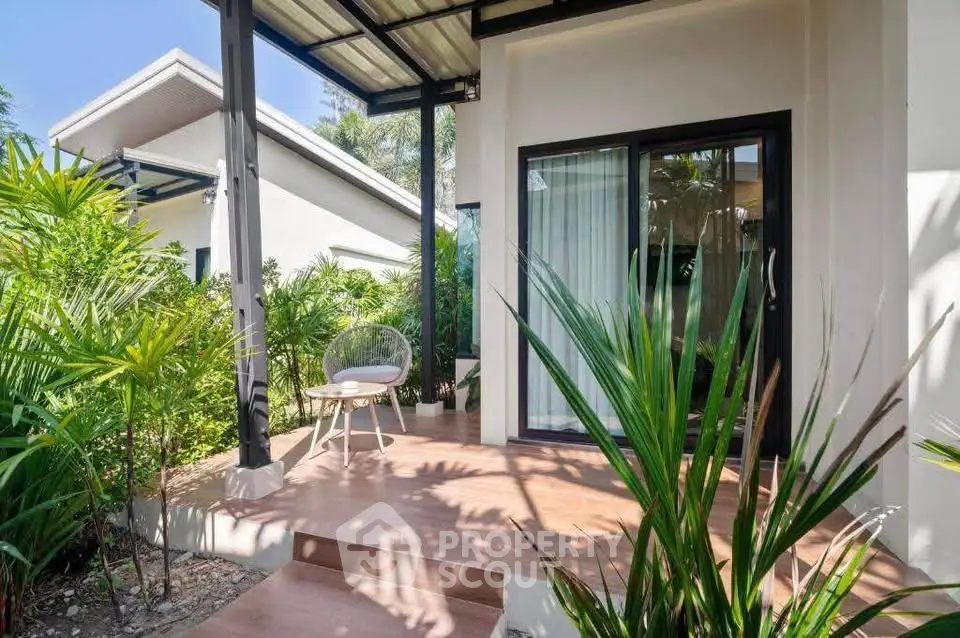 Charming tropical villa with lush garden and inviting patio, perfect for relaxation and outdoor enjoyment.