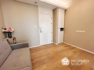 Modern living room with wooden flooring and neutral tones