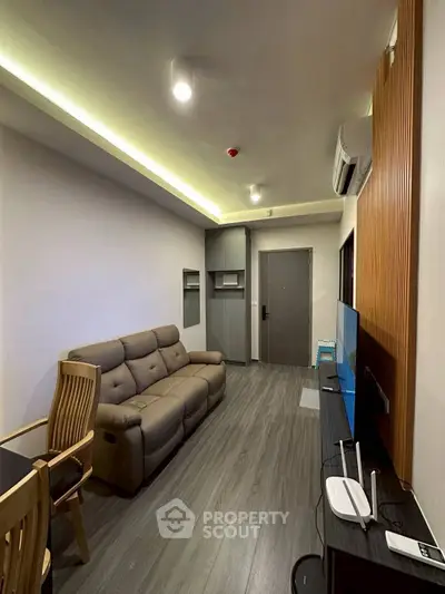 Modern living room with sleek design and cozy seating area