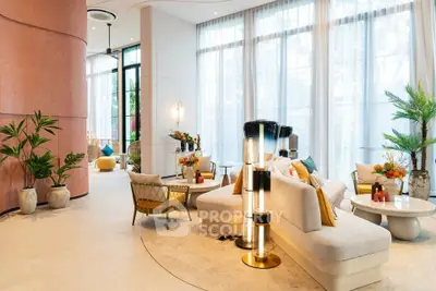 Luxurious modern living room with elegant decor and large windows