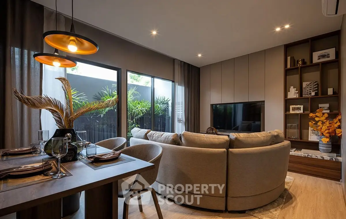 Luxurious modern living room with elegant decor and large windows