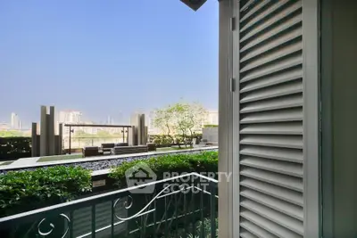 Luxurious balcony view with lush greenery and cityscape in the background, perfect for relaxation.