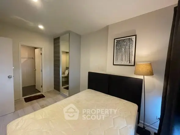 Cozy bedroom with modern decor and ample closet space