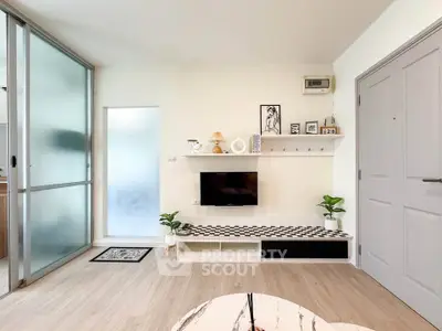 Modern living room with stylish decor and sliding glass door