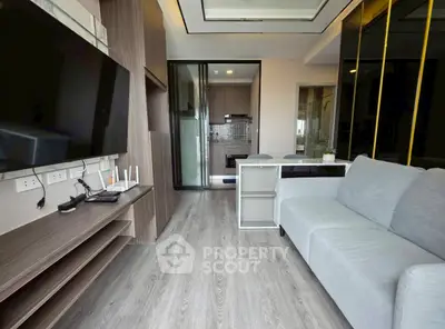 Modern living room with sleek design and open kitchen layout