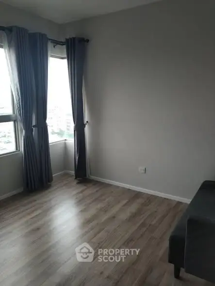 Spacious corner unit with large windows and elegant flooring