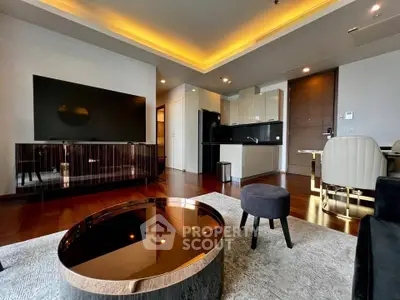 Luxurious modern living room with sleek furniture and open kitchen layout