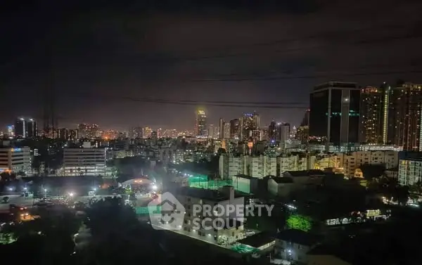 Stunning night cityscape view showcasing vibrant urban skyline and illuminated buildings.