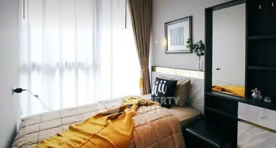 Cozy bedroom with modern decor and natural light
