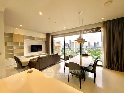 Luxurious living room with stunning city view, modern furniture, and open layout in high-rise apartment.