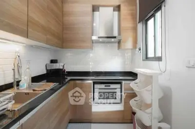 Modern kitchen with sleek wooden cabinets and built-in oven