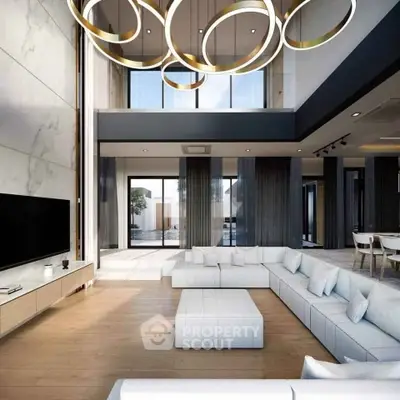 Luxurious modern living room with high ceilings and elegant lighting fixtures.