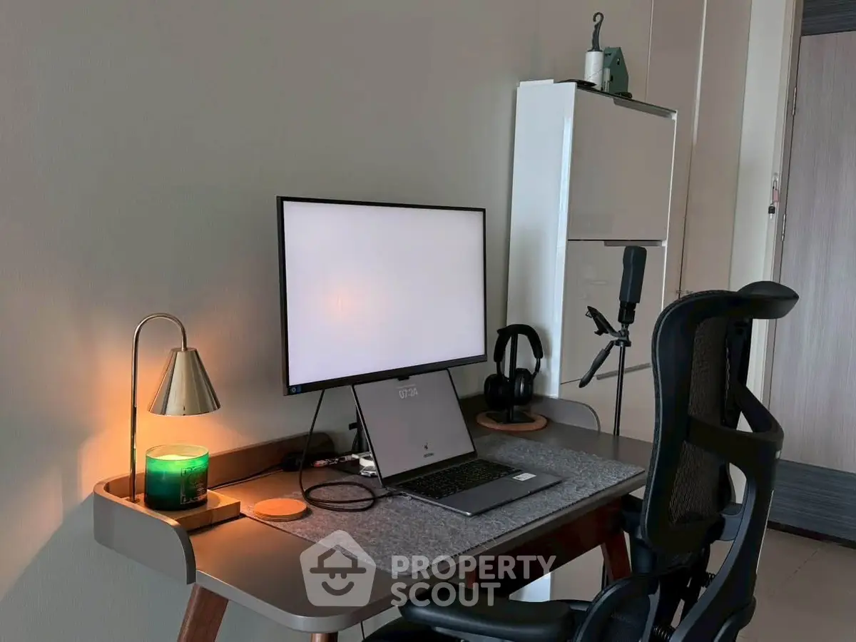Modern home office setup with sleek desk, ergonomic chair, and computer monitor