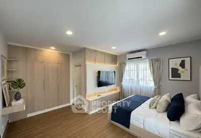 Spacious modern bedroom with elegant decor and natural light