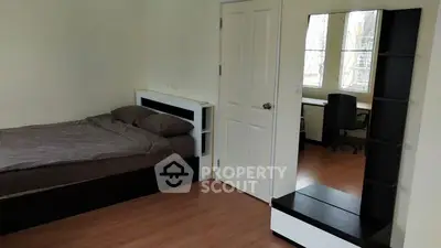 Cozy bedroom with modern furniture and natural light