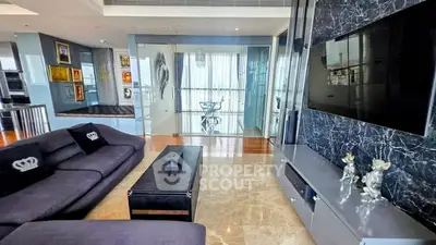 Luxurious living room with modern decor and marble flooring in high-end apartment.