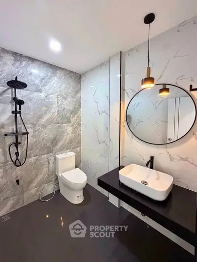 Modern bathroom with sleek fixtures and elegant marble tiles