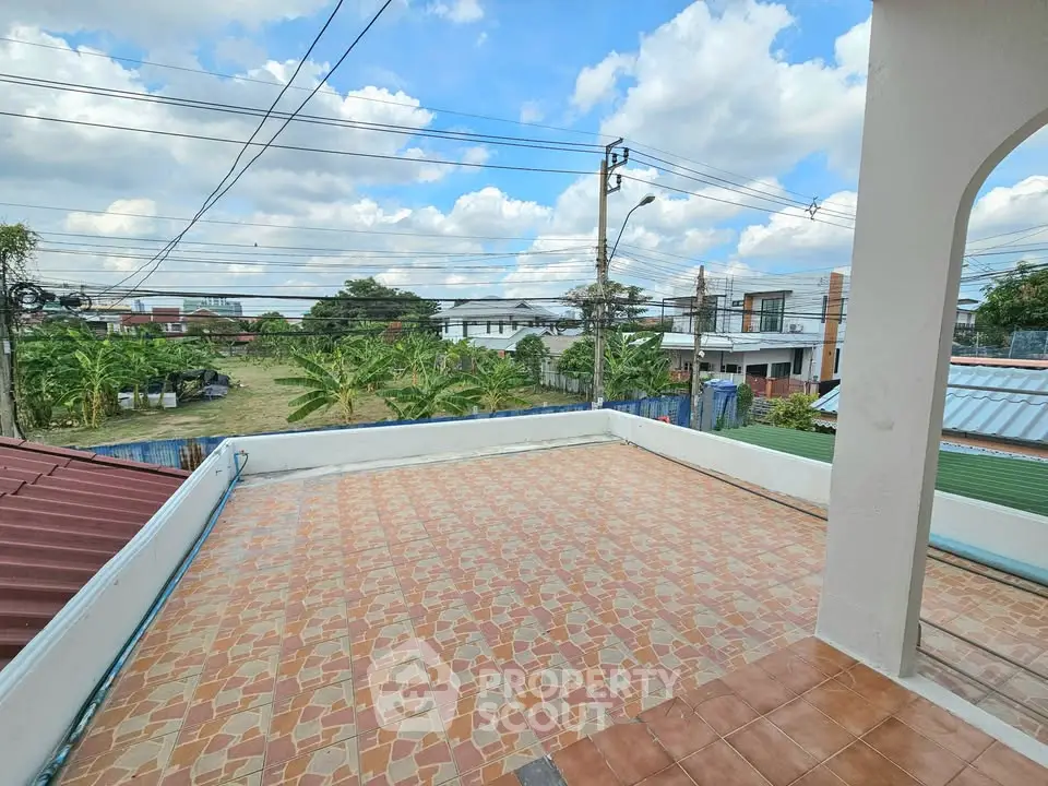 Spacious rooftop terrace with scenic suburban views and tiled flooring.