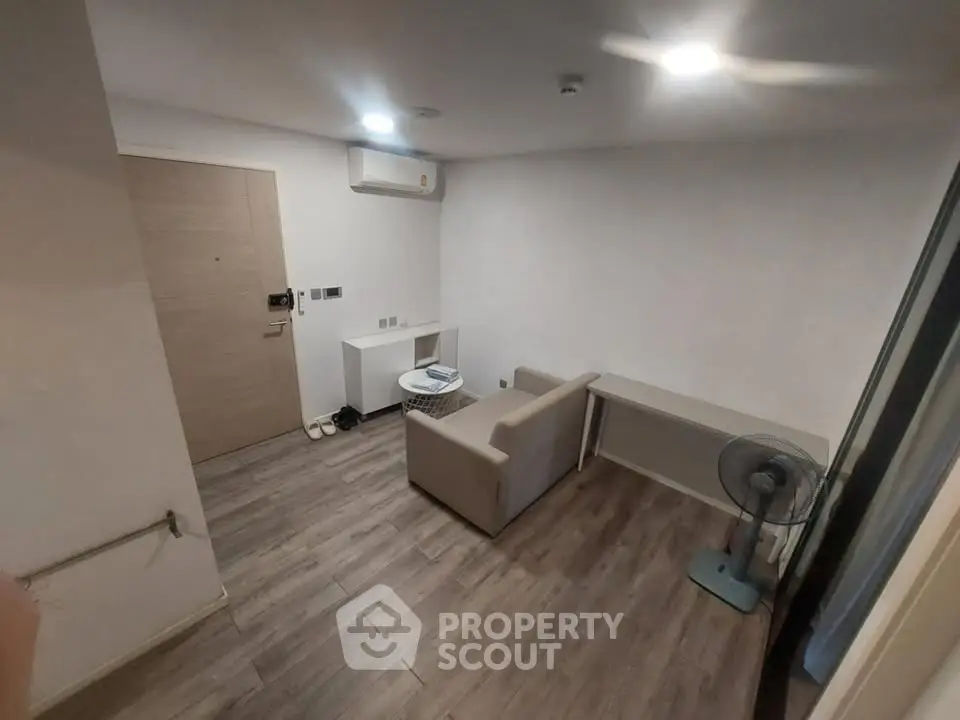 Cozy minimalist living room with modern decor and wooden flooring