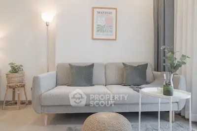 Modern living room with stylish gray sofa and elegant decor