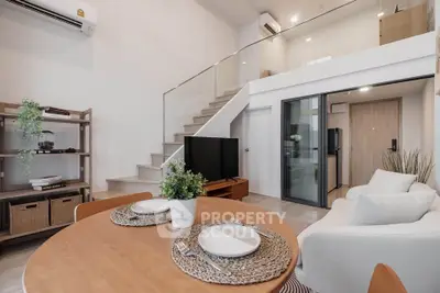 Modern duplex living room with stylish decor and open layout