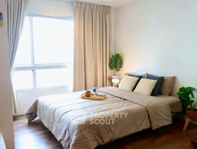 Cozy and inviting bedroom with natural light and stylish decor, perfect for relaxation and comfort.