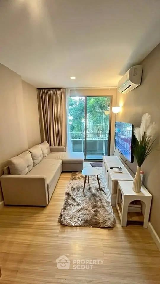 Cozy living room with modern decor and balcony view