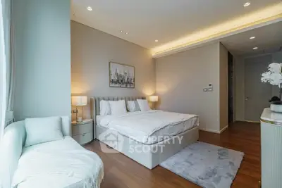 Luxurious bedroom with elegant decor and cozy ambiance, featuring a plush bed and stylish lighting.