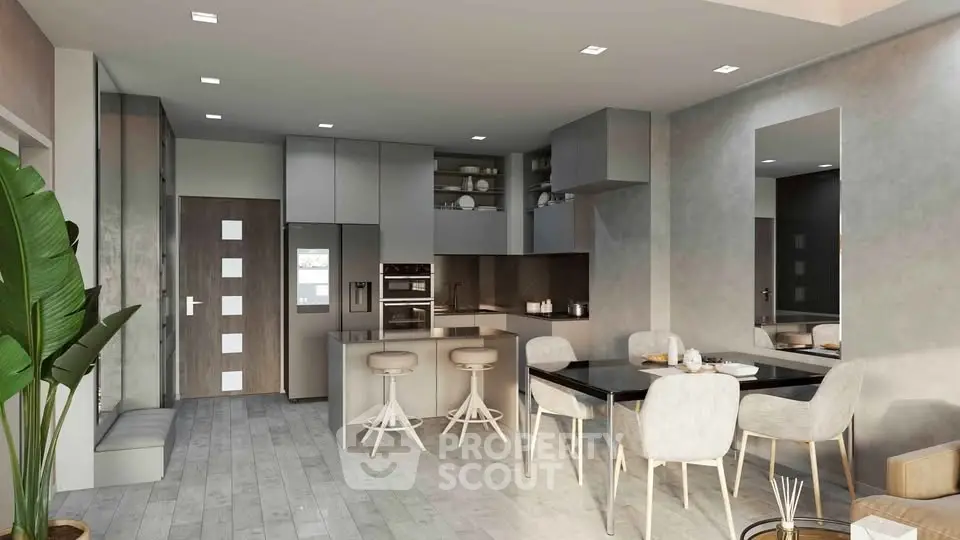 Modern open-plan kitchen and dining area with sleek design and neutral tones.