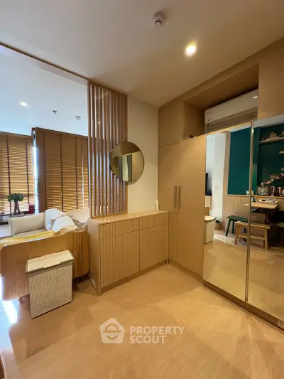 Modern living room with wooden accents and stylish decor in a cozy apartment.